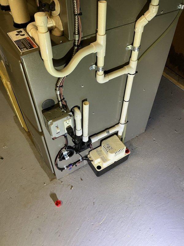 Responded to service call for furnace tripping issue on 2024 model unit located in basement. Upon inspection, verified proper electrical connections at dedicated disconnect switch and outlet, confirmed condensate pump operation and drainage system functionality, and examined all PVC condensate line connections and routing. System tested successfully with no tripping observed; all components operating within normal parameters under both part and labor warranty coverage.