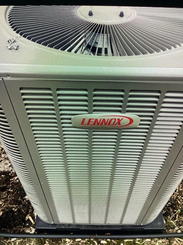 Completed annual cooling maintenance on Lennox condenser unit. Inspected unit exterior, fan assembly, and internal components. Found heavy accumulation of organic growth, algae, and debris on condenser coil and intake surfaces. Cleaned and treated affected areas to restore proper airflow and system efficiency. Verified fan operation and mounting hardware integrity. Unit returned to normal operating condition following maintenance procedures.
