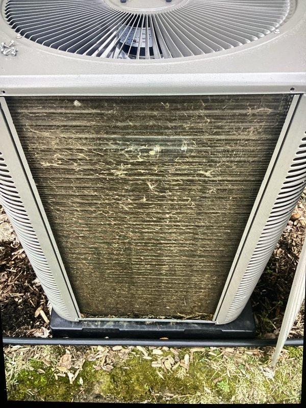 Completed annual cooling maintenance on Lennox condenser unit. Inspected unit exterior, fan assembly, and internal components. Found heavy accumulation of organic growth, algae, and debris on condenser coil and intake surfaces. Cleaned and treated affected areas to restore proper airflow and system efficiency. Verified fan operation and mounting hardware integrity. Unit returned to normal operating condition following maintenance procedures.