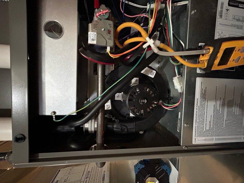 Replaced defective inducer motor assembly on residential HVAC unit under parts warranty coverage. Removed existing motor, installed replacement Lennox component, verified proper electrical connections and wire routing, and tested system operation to confirm draft induction functionality and safe combustion air flow.