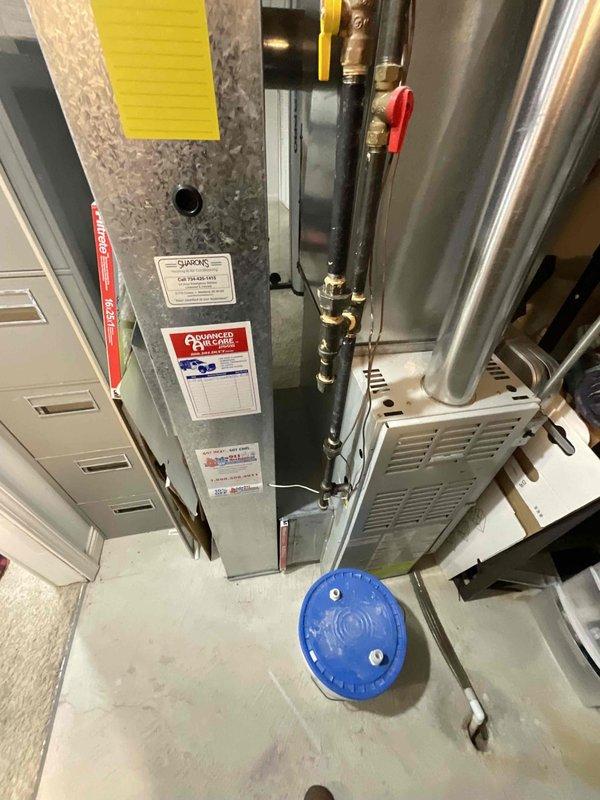 Provided comprehensive estimate for complete HVAC system replacement including natural gas furnace located in basement and outdoor air conditioning unit. Existing 25+ year old equipment currently operational but nearing end of service life, with visible age-related wear on outdoor condenser unit and electrical connections showing rust deterioration. Proposal includes BOGO promotion for furnace and AC replacement to improve energy efficiency and system reliability.