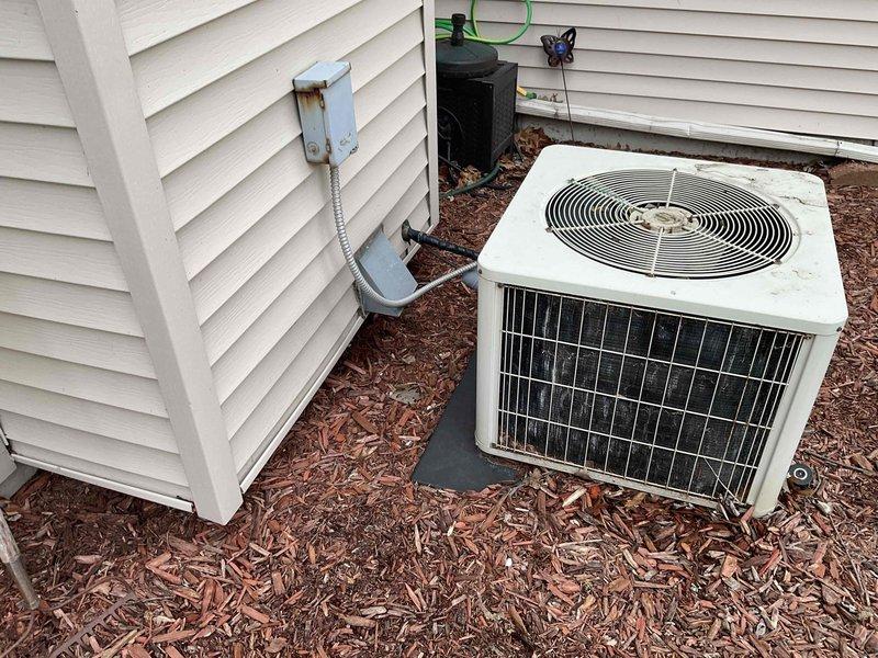 Provided comprehensive estimate for complete HVAC system replacement including natural gas furnace located in basement and outdoor air conditioning unit. Existing 25+ year old equipment currently operational but nearing end of service life, with visible age-related wear on outdoor condenser unit and electrical connections showing rust deterioration. Proposal includes BOGO promotion for furnace and AC replacement to improve energy efficiency and system reliability.