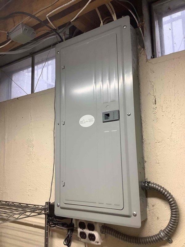 Completed electrical estimate for new whole home Generac generator installation at manufactured home residence. Assessed existing electrical panel configuration, verified circuit breaker capacity and available space for generator integration, and documented current electrical infrastructure including main service panel location in basement utility area with exposed conduit routing. Confirmed feasibility of generator connection to existing electrical system and provided comprehensive quote for complete installation including necessary transfer switch equipment and electrical connections to support automatic backup power system.