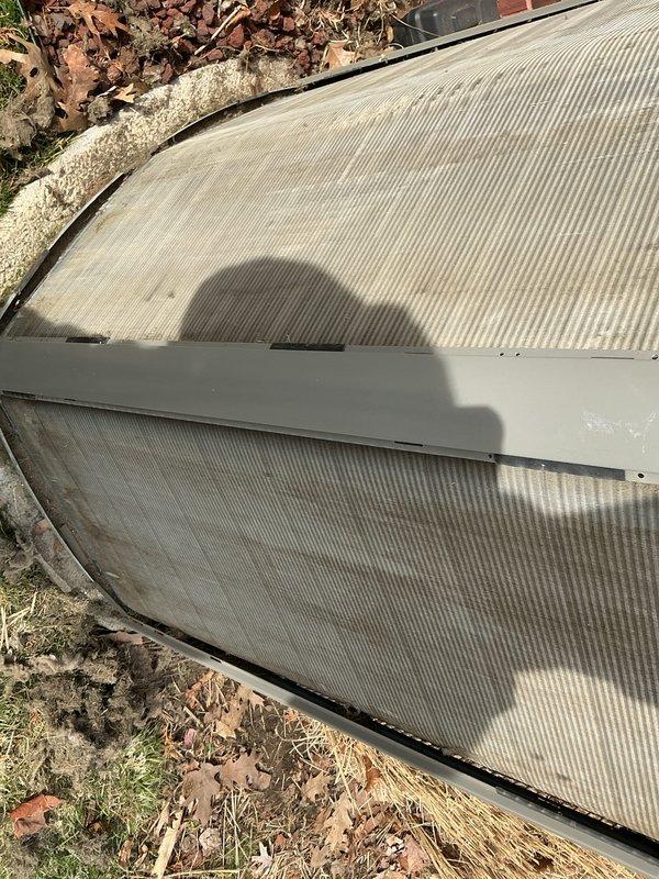 Completed complimentary spring AC tune-up maintenance as part of active membership plan. Performed comprehensive system inspection on residential air conditioning unit including filter examination and replacement. Removed deteriorated outdoor condenser enclosure panels showing significant weathering, UV damage, and material breakdown along edges and fastening points. Panels exhibited moisture staining and structural degradation from extended outdoor exposure. Documented equipment condition with photographs for service records. System operational upon completion of scheduled preventive maintenance visit.