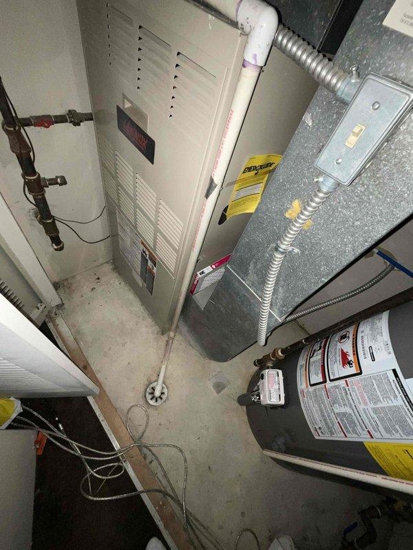 Conducted on-site assessment for furnace replacement in residential owner-occupied property with 31-35 year old existing heating system. Evaluated current HVAC installation including furnace unit with connected PVC venting, copper refrigerant lines, metal plenum ductwork, and flexible aluminum ducting. Documented existing equipment configuration, electrical connections, and mechanical room layout to prepare comprehensive replacement estimate for aging furnace system that has reached end of serviceable life.