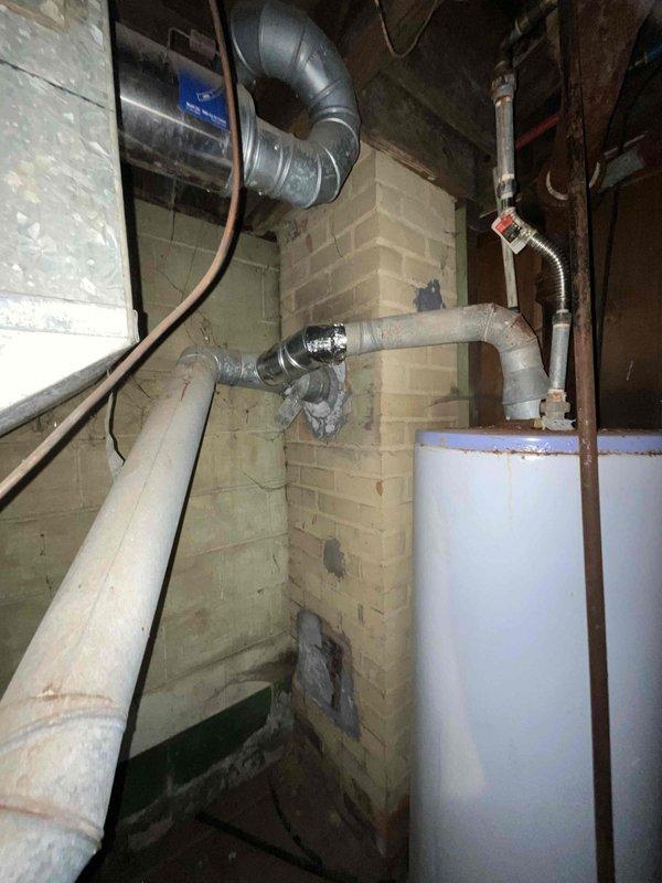 Conducted estimate for complete HVAC system replacement in basement location, including both furnace and air conditioning unit under promotional offer. Existing 20+ year old natural gas furnace and AC system are non-operational and require full replacement. Documented current equipment configuration, ductwork layout, and utility connections including water heater proximity and existing infrastructure to provide accurate replacement proposal.