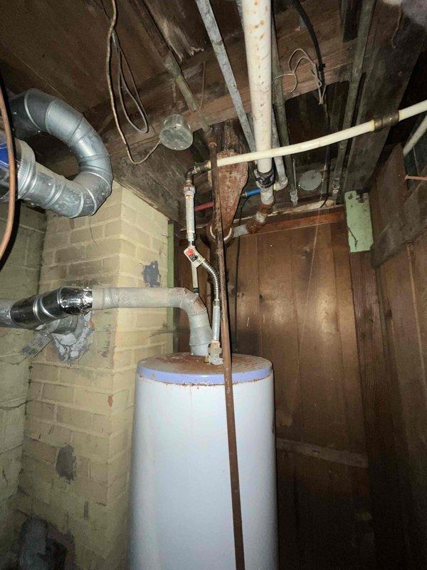 Conducted estimate for complete HVAC system replacement in basement location, including both furnace and air conditioning unit under promotional offer. Existing 20+ year old natural gas furnace and AC system are non-operational and require full replacement. Documented current equipment configuration, ductwork layout, and utility connections including water heater proximity and existing infrastructure to provide accurate replacement proposal.