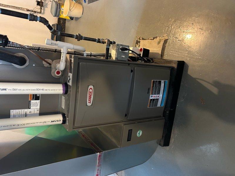 Responded to prior service call for Lennox furnace maintenance inspection. Verified proper ignition and burner operation with all burner ports showing clean blue flame combustion. Inspected gas manifold assembly, electrical connections, blower motor, and all associated mechanical components for proper function and safety compliance.