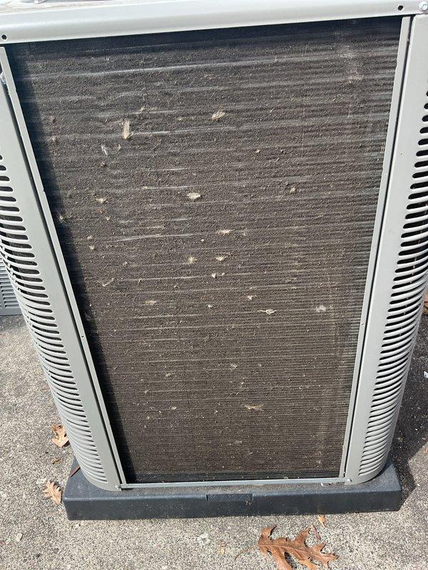 Completed scheduled air conditioning maintenance on outdoor condensing unit. Inspected system components and documented heavily soiled filter panel and condenser coil with significant dust, dirt, and debris accumulation restricting airflow. Unit requires replacement evaporative cooling pads and filters to restore proper system efficiency and performance.
