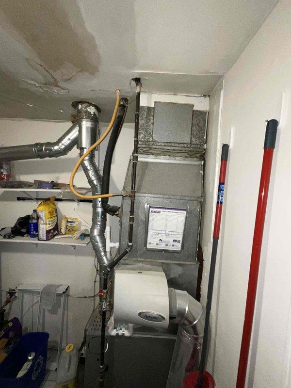 Completed plumbing estimate for water heater replacement at residential property. Evaluated existing HVAC and utility systems in mechanical room, documented current equipment configuration including furnace, air handler, and exterior AC condenser unit. Provided comprehensive assessment and recommendations for water heater installation requirements.