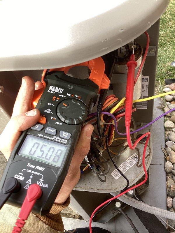 Completed annual cooling maintenance on outdoor condensing unit. Performed electrical diagnostics using digital multimeter, verifying capacitor microfarad readings and system voltage levels. All electrical components tested within manufacturer specifications. Unit operating normally with no deficiencies noted.