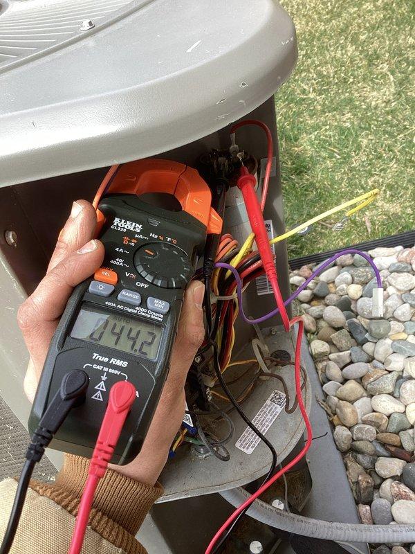 Completed annual cooling maintenance on outdoor condensing unit. Performed electrical diagnostics using digital multimeter, verifying capacitor microfarad readings and system voltage levels. All electrical components tested within manufacturer specifications. Unit operating normally with no deficiencies noted.