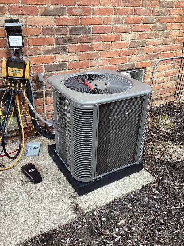 Completed annual ComfortGuard maintenance package on four-year-old furnace and air conditioning system under active warranty. Performed comprehensive tune-up including inspection of blower assembly, control board, electrical connections, and refrigerant lines on furnace unit; verified proper operation of all safety controls and heating components. Conducted outdoor condenser unit inspection with manifold gauge testing to assess refrigerant pressures and system performance. Replaced humidifier filter as requested. Reviewed warranty documentation on site to confirm coverage status. Both systems operating within manufacturer specifications with no deficiencies noted. All components functioning properly on black rubber equipment pad.