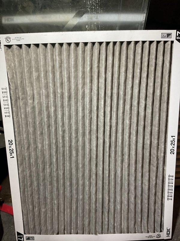 Completed comprehensive HVAC tune-up on 5+ year old basement unit, including thorough inspection of furnace, humidifier, thermostat, and hot water tank. Replaced heavily soiled air filter showing significant dust and debris accumulation with new pleated filter to restore proper airflow and system efficiency. Installed new humidifier pad and verified all system components operating within normal parameters.