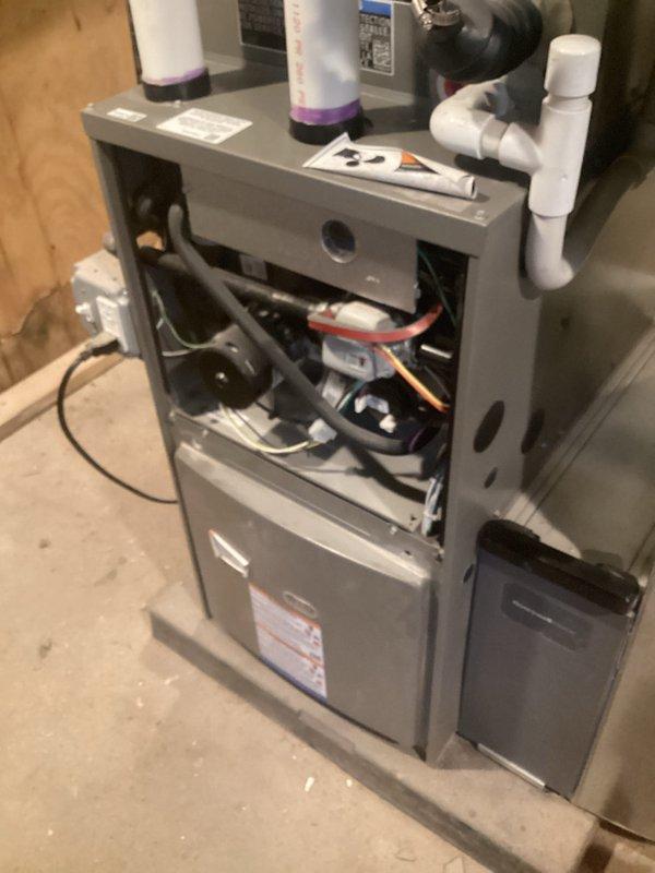 Completed annual furnace heating maintenance and tune-up on 10-year-old residential forced-air heating system as part of preventative care membership. Performed comprehensive inspection of blower motor assembly, electrical connections, and control components with access panel removed for thorough evaluation. Documented existing air filter condition and humidifier components, verified proper operation of all mechanical systems, and ensured unit is functioning within manufacturer specifications for the upcoming heating season.