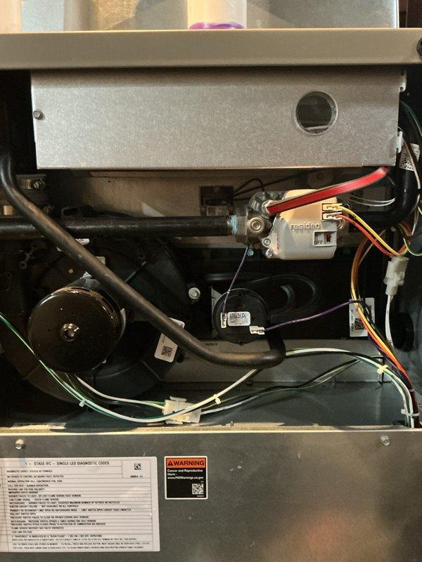 Completed comprehensive tune-up and post-installation inspection of furnace system experiencing recurring GFCI outlet trips every two months. Performed thorough examination of all electrical connections, internal components, and wiring systems to identify potential causes of power interruption. Inspected Resideo control board, motor assembly, wire harnesses, and all electrical terminations for proper installation, grounding issues, or moisture infiltration that could trigger GFCI protection. Documented system condition with detailed photography of internal components, wiring configurations, and manufacturer specifications. Verified all mechanical and electrical components operating within normal parameters during inspection period.