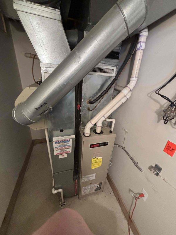 Performed comprehensive evaluation of 16-year-old Tappan furnace system and outdoor condensing unit for full system replacement estimate. Diagnosed failed control board on existing furnace unit and determined that due to age and condition of equipment, complete system replacement would be more cost-effective than repair. Documented existing HVAC installation including ductwork configuration, PVC condensate drainage, electrical disconnect components, and outdoor condenser placement on concrete pad. Provided detailed replacement options and recommendations for new system installation, with service credit applied toward future equipment purchase.