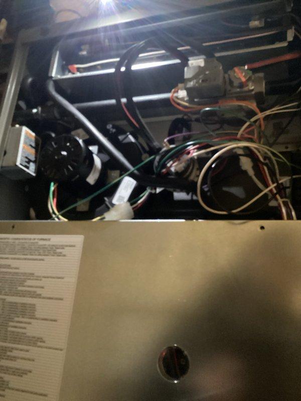 Completed comprehensive HVAC maintenance inspection on air handling unit including examination of heat exchanger assembly, gas valve controls, electrical connections, and blower motor components. Verified all wiring connections are secure, gas valve operation within normal parameters, and system components are functioning properly per manufacturer specifications.