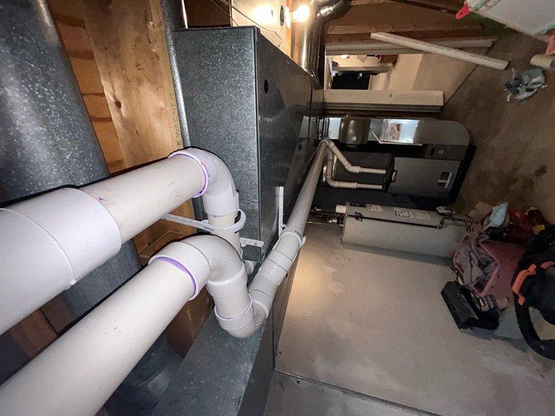Replaced defective exhaust pipe on HVAC system in basement utility area. System tested and verified proper venting operation upon completion, with homeowner's authorized representative present to approve repair work.