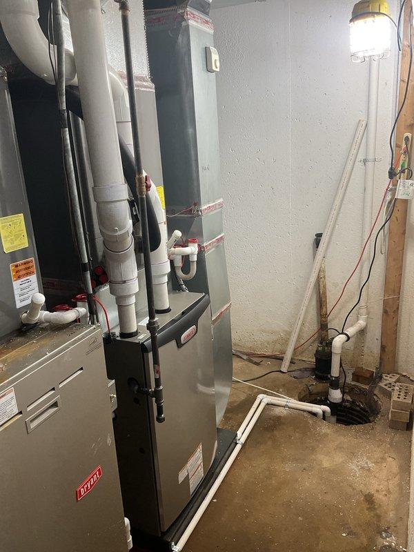 Completed installation of 90,000 BTU gas furnace in basement mechanical room. Installed new Bryant furnace unit with PVC vent piping and condensate drain lines properly secured to structural supports. Performed all electrical wiring connections and reconnected unit to existing ductwork system. All work completed per mechanical permit requirements with system tested and operational upon completion.