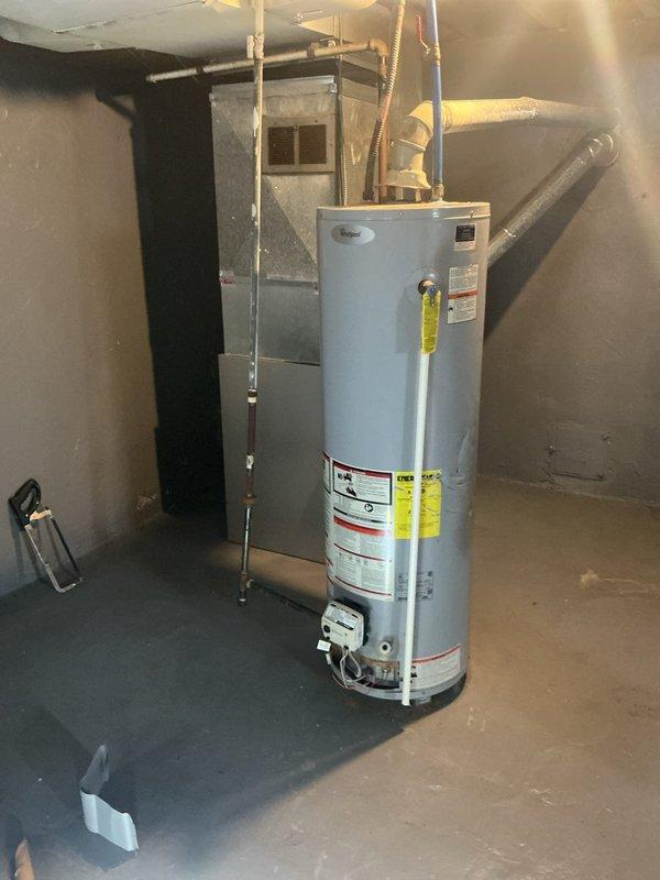 Responded to no hot water complaint and performed diagnostic inspection of tanked water heater. Upon examination, discovered significant corrosion and rust staining at the base of the unit, with visible deterioration of internal components and evidence of previous water leakage. The pilot assembly and burner chamber showed extensive mineral deposits and moisture damage, indicating the unit had experienced water intrusion compromising the heating elements and internal tank integrity. Completed diagnostic evaluation and documented findings with photographic evidence of the corroded base, deteriorated insulation, and compromised internal components for customer review and repair recommendations.