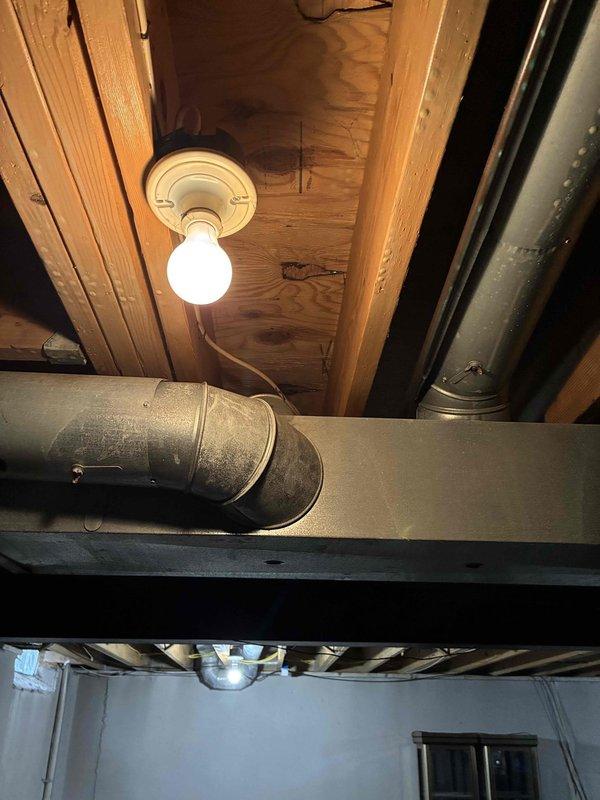 Responded to request for backup sump pump installation. Conducted diagnostic assessment of existing sump pump system and basement infrastructure to determine optimal configuration for secondary pump installation. Evaluated electrical routing through basement ceiling joists and mechanical space to ensure proper power supply for backup system. Assessed drainage piping layout and discharge line accessibility to integrate backup pump with existing primary system, ensuring redundant protection against basement flooding.