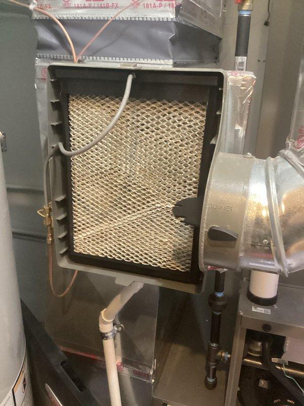 # HVAC Maintenance - AHC Completed

Performed comprehensive annual furnace maintenance on residential heating system. Conducted complete system inspection with access panels removed to assess internal components and electrical connections. Utilized multimeter to perform diagnostic testing of electrical circuits, measuring voltage and amperage to verify proper system operation. All electrical connections, wiring, and control components were inspected and found to be functioning within manufacturer specifications.

Inspected air filtration system and confirmed proper filter installation and condition. Examined honeycomb-pattern mesh filter for adequate airflow and debris accumulation. Verified blower motor housing and associated components for proper operation. Inspected condensate drain lines, PVC piping, and refrigerant line connections for secure mounting and absence of leaks.

Assessed furnace cabinet condition, burner assembly access, and all safety controls. Verified proper clearan