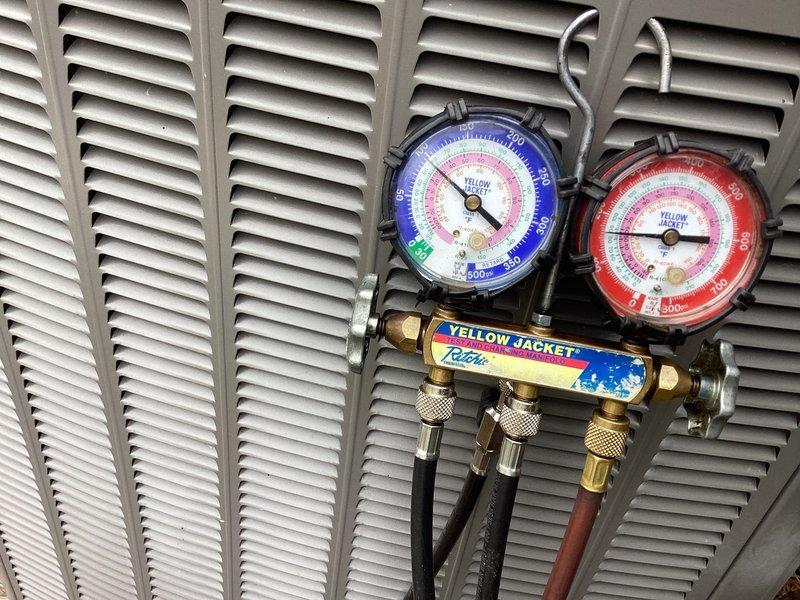 Completed annual cooling maintenance on residential HVAC system. Performed system diagnostics including supply air temperature measurements at ductwork (38.4°F recorded) and refrigerant pressure analysis using manifold gauges to verify proper system operation and charge levels. Noted visible rust staining on ductwork seams requiring future monitoring, but system operating within normal parameters at time of service.