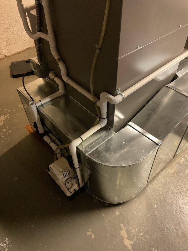 Responded to service call for furnace making noise during operation. Upon inspection of the 3-year-old unit located in basement, examined blower assembly, ductwork connections, and condensate drainage system. Verified proper operation of air handler, checked for loose components or debris in blower wheel, and inspected all mounting hardware for secure installation. System tested through complete heating cycle with no abnormal sounds detected at time of service. Unit operating within normal parameters under both part and labor warranty coverage.