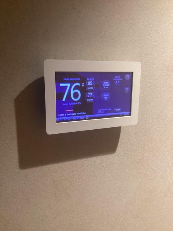 Responded to service call for two 13-year-old furnaces located in basement that were heating but failing to reach set temperature, requiring thermostat settings 5+ degrees above desired temperature to achieve comfort levels. Performed diagnostic evaluation on both units and verified operational status while units were actively heating. Assessed thermostat programming and temperature differential issues, documenting current indoor temperatures of 74-76°F while set points were programmed to 85°F, with systems running continuously in heating and humidifying mode but unable to satisfy thermostat demand.