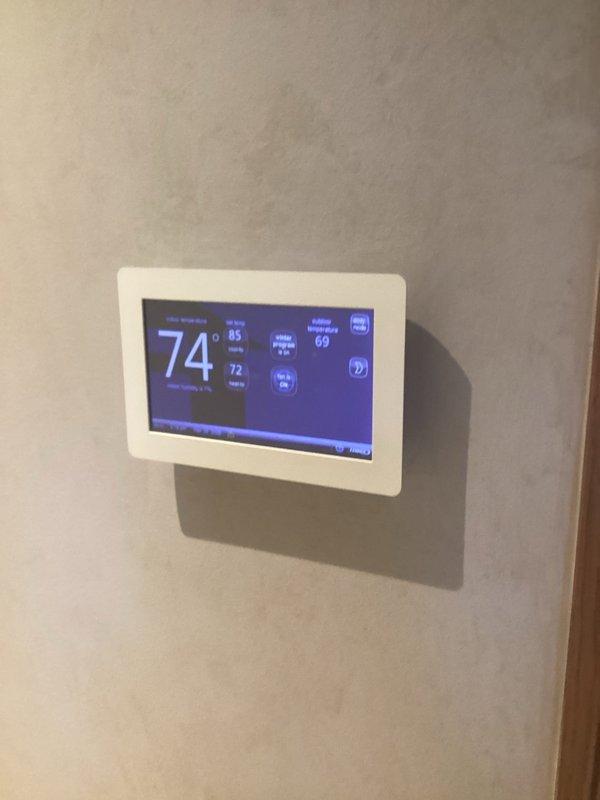 Responded to service call for two 13-year-old furnaces located in basement that were heating but failing to reach set temperature, requiring thermostat settings 5+ degrees above desired temperature to achieve comfort levels. Performed diagnostic evaluation on both units and verified operational status while units were actively heating. Assessed thermostat programming and temperature differential issues, documenting current indoor temperatures of 74-76°F while set points were programmed to 85°F, with systems running continuously in heating and humidifying mode but unable to satisfy thermostat demand.