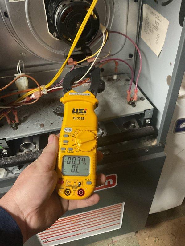 Performed comprehensive annual furnace maintenance on Goodman HVAC unit, including electrical diagnostics using digital multimeter to verify proper voltage readings and system performance. Inspected blower motor assembly, burner components, and all electrical connections; confirmed all wiring and internal components were functioning within normal parameters. Customer was informed that air conditioning maintenance is a separate service and was scheduled for a future reminder notification.