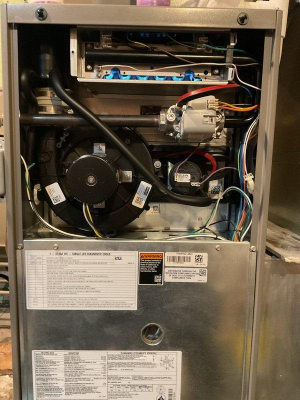 Completed scheduled Air Handler Maintenance on Lennox residential HVAC system. Opened front access panel and performed comprehensive inspection of all internal components including blower motor assembly, draft inducer motor, gas valve, burner assembly, and electrical connections. Verified proper operation of multi-port burner system and checked all wiring harnesses for secure connections and signs of wear. Inspected condensate drain lines and PVC vent piping for proper installation and drainage. Examined blower motor and secondary fan for unusual noise or vibration. Reviewed all manufacturer specification labels and safety warnings for compliance. System operating within normal parameters with no issues identified during maintenance visit.