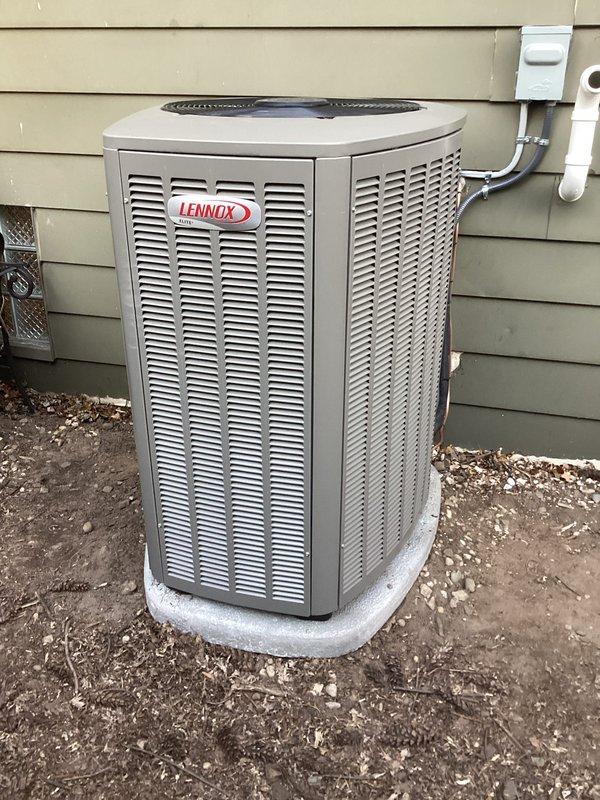 Completed full HVAC system installation including 70,000 BTU furnace with liner and 2-ton Lennox air conditioning unit with rear discharge configuration. Installed humidifier, performed duct alterations in basement, and ran new dedicated electrical circuit with disconnect. All mechanical and electrical permits obtained and work performed to code specifications, with outdoor condensing unit mounted on composite pad with PVC condensate drainage and indoor air handler integrated with existing ductwork infrastructure.