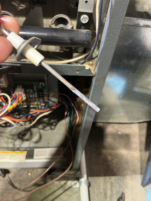 Responded to no-heat call on basement-located furnace less than 10 years old with thermostat set to 77°F but unit failing to initiate heating cycle. Performed diagnostic assessment of furnace components including temperature sensor testing, control board inspection, and thermostat signal verification. Examined internal wiring connections, terminal blocks, and electrical components for proper continuity and secure connections. Assessed venting system integrity and verified proper installation of exhaust components. Documented system conditions through diagnostic photography showing temperature probe readings and internal component configuration to identify cause of heating failure and restore proper furnace operation.