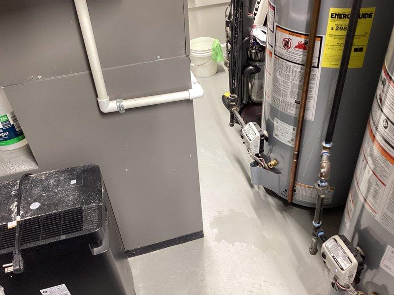 Responded to water leak complaint under furnace. Upon inspection, found heavily soiled air filter with significant dust accumulation causing restricted airflow and potential condensate drainage issues. Verified condensate drain line routing and confirmed no active leaks at time of service. Inspected HVAC system components, water heaters, and surrounding utility area for moisture sources. No parts installed per service agreement terms, no warranty applicable on this visit.