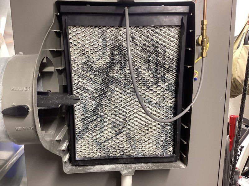 Responded to water leak complaint under furnace. Upon inspection, found heavily soiled air filter with significant dust accumulation causing restricted airflow and potential condensate drainage issues. Verified condensate drain line routing and confirmed no active leaks at time of service. Inspected HVAC system components, water heaters, and surrounding utility area for moisture sources. No parts installed per service agreement terms, no warranty applicable on this visit.