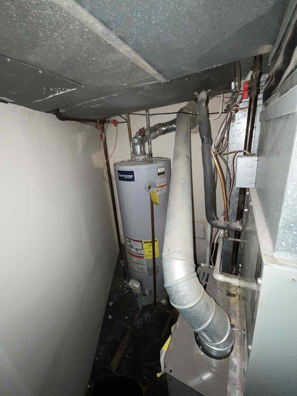 Conducted comprehensive full system evaluation for 16-year-old residential air conditioning unit requiring replacement within the month. Assessed existing HVAC infrastructure in basement utility area, including furnace, ductwork configuration, and electrical service capacity. Documented current system layout and photographed equipment positioning to prepare detailed replacement estimate for complete AC system installation.