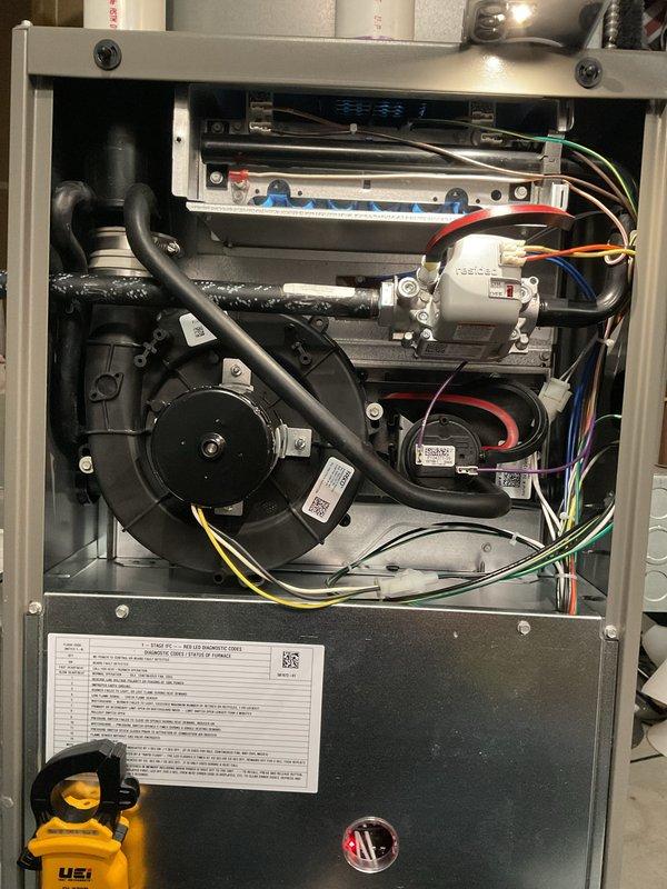 Completed routine maintenance tune-up on one-year-old forced air furnace system. Performed comprehensive inspection of all internal components including blower motor assembly, electrical connections, control board, and safety devices. Verified proper operation of gas valve, ignition system, and heat exchanger. Checked and tested all wiring connections for secure contact. Inspected condensate drainage system and associated pump for proper function. Confirmed PVC intake and exhaust venting is clear and properly secured. Tested blower motor operation and verified airflow through system. All components operating within manufacturer specifications with no issues identified. Unit left in proper working condition.