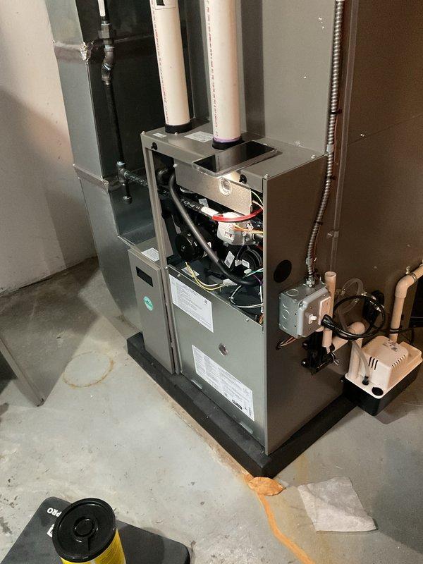 Completed routine maintenance tune-up on one-year-old forced air furnace system. Performed comprehensive inspection of all internal components including blower motor assembly, electrical connections, control board, and safety devices. Verified proper operation of gas valve, ignition system, and heat exchanger. Checked and tested all wiring connections for secure contact. Inspected condensate drainage system and associated pump for proper function. Confirmed PVC intake and exhaust venting is clear and properly secured. Tested blower motor operation and verified airflow through system. All components operating within manufacturer specifications with no issues identified. Unit left in proper working condition.