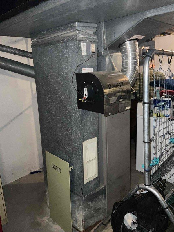 Conducted comprehensive on-site evaluation for furnace replacement at residential property. Assessed existing 40-year-old heating system, documenting current equipment configuration including air handler unit, ductwork connections, refrigerant lines, and electrical components. Photographed mechanical room layout, existing furnace installation, filter access panels, blower assembly, and associated HVAC infrastructure to provide detailed replacement estimate and system specifications for aging heating equipment.