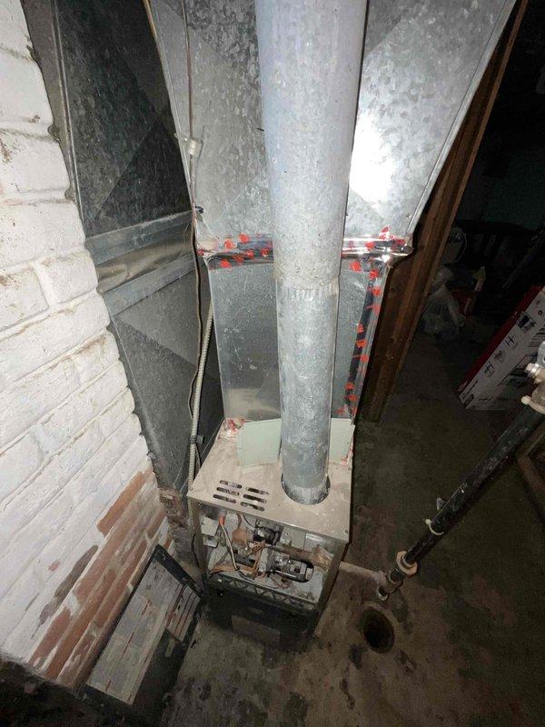 Conducted comprehensive site assessment for full HVAC system replacement in residential property. Evaluated existing heating and cooling infrastructure, including aged furnace with vertical ductwork and metal trunk lines showing significant dust accumulation and weathering. Documented electrical panel configuration and circuit layout to determine compatibility requirements for new equipment installation. Inspected basement mechanical room layout, concrete block foundation, and existing ductwork routing to develop replacement system specifications. Photographed current equipment conditions and electrical service capacity. Provided detailed estimate for new air conditioning system installation with recommended equipment sizing based on home's heating and cooling distribution infrastructure.