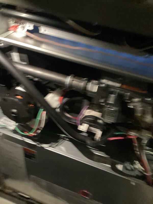 Completed comprehensive tune-up on 1-year-old furnace system located in basement. Performed thorough inspection of heating unit, humidifier, thermostat, and hot water tank, verifying proper operation of burner assembly with clean blue flame pattern and confirming all gas valve connections, electrical wiring, and safety controls functioning correctly. Supplied and installed replacement filters/pads as needed to maintain optimal system performance.