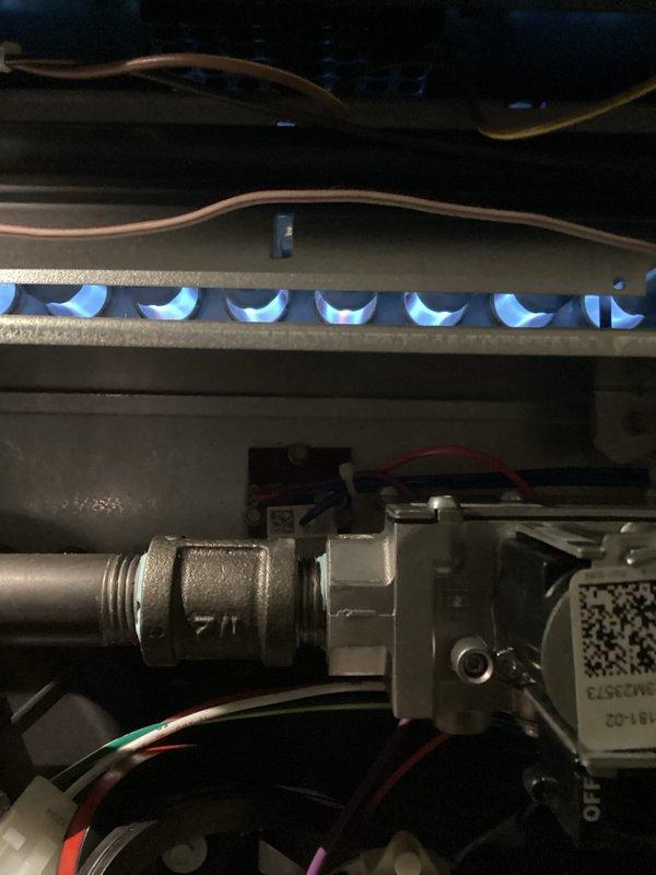 Completed comprehensive tune-up on 1-year-old furnace system located in basement. Performed thorough inspection of heating unit, humidifier, thermostat, and hot water tank, verifying proper operation of burner assembly with clean blue flame pattern and confirming all gas valve connections, electrical wiring, and safety controls functioning correctly. Supplied and installed replacement filters/pads as needed to maintain optimal system performance.