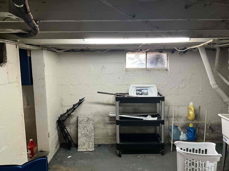 Completed commercial HVAC system installation in basement utility area. Installed new heating equipment and associated ductwork, including metallic-wrapped supply ducts and flexible duct runs. Routed white PVC condensate drainage lines along ceiling joists to ensure proper system drainage. All components tested and verified operational upon completion.