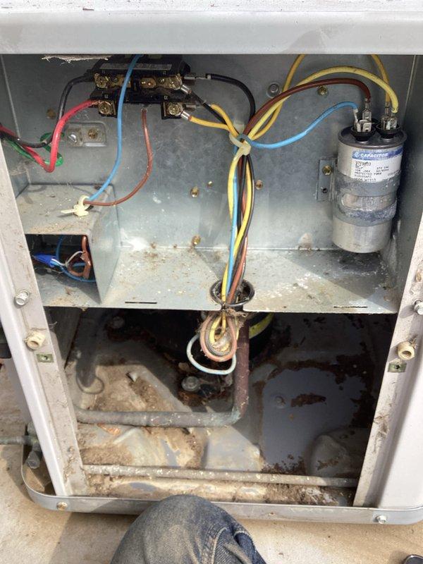 # HVAC Maintenance - AHC Completed

Performed comprehensive air conditioning and heating maintenance service on residential split system. Replaced humidifier pad and furnace filter as scheduled. Inspected outdoor condenser unit, confirming proper fan operation and checking refrigerant levels. Unit exterior in good condition with no visible damage or deterioration. Opened electrical panel and inspected internal components including capacitor, contactors, and wiring connections. Noted significant rust and corrosion present in lower compartment of outdoor unit, indicating previous moisture exposure. All electrical connections secure and functioning properly despite oxidation in bottom section. Documented equipment condition with photographs for service records. System operating within normal parameters at time of service completion.