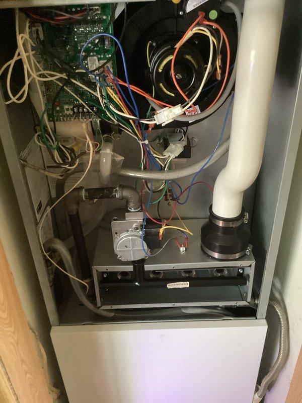 Performed comprehensive annual tune-up on 1-year-old forced air furnace system. Conducted thorough inspection of all major components including heat exchanger, burner assembly, gas valve, blower motor, control board, and electrical connections. Verified proper operation of ignition system, flame sensor, and safety controls. Cleaned burners, inspected flue piping and condensate drain system, checked all wiring harnesses and connections for secure mounting, and confirmed system cycling and airflow performance. All components operating within manufacturer specifications with no deficiencies noted. System returned to normal operation with proper heating functionality confirmed.