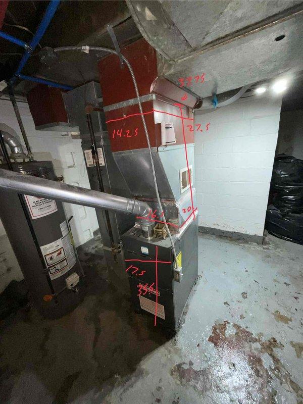 Conducted site assessment for air conditioning system installation at residential property currently without cooling equipment. Evaluated basement-located natural gas furnace and existing ductwork configuration to determine compatibility and requirements for new A/C system addition. Documented equipment dimensions and spatial measurements to prepare comprehensive replacement estimate for complete cooling system integration with existing heating infrastructure.