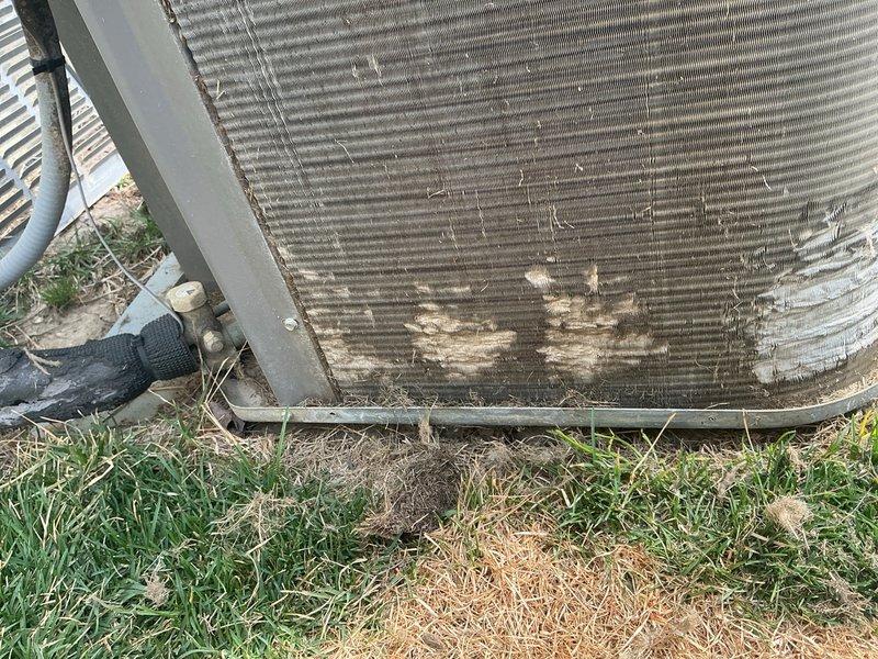Completed scheduled air conditioning maintenance on residential condenser unit. Inspected outdoor unit which showed significant debris accumulation on coil fins including dirt, grass clippings, and organic material. Cleaned condenser coils, replaced air filter, and performed standard ACM maintenance procedures. Unit operational upon completion.