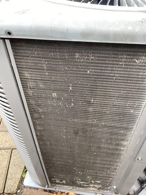 Completed annual cooling maintenance on rooftop zone unit. Inspected condenser coil and found heavy accumulation of dust, dirt, debris, and fibrous material restricting airflow through fins. Cleaned condenser coil thoroughly to restore proper heat transfer efficiency. Removed access panels, evaluated internal components, and verified unit operational status. Documented equipment condition with photographs showing before-condition of heavily soiled coil with significant particulate buildup. Unit returned to normal operating parameters following coil cleaning and system evaluation.